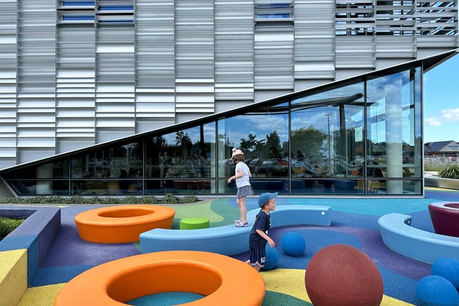 A boy and girl playing in a sensory space.