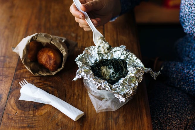Food in a tin foil wrap.