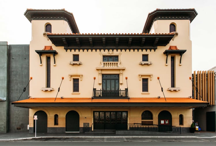 The orange exterior of the Hastings Municipal Building.