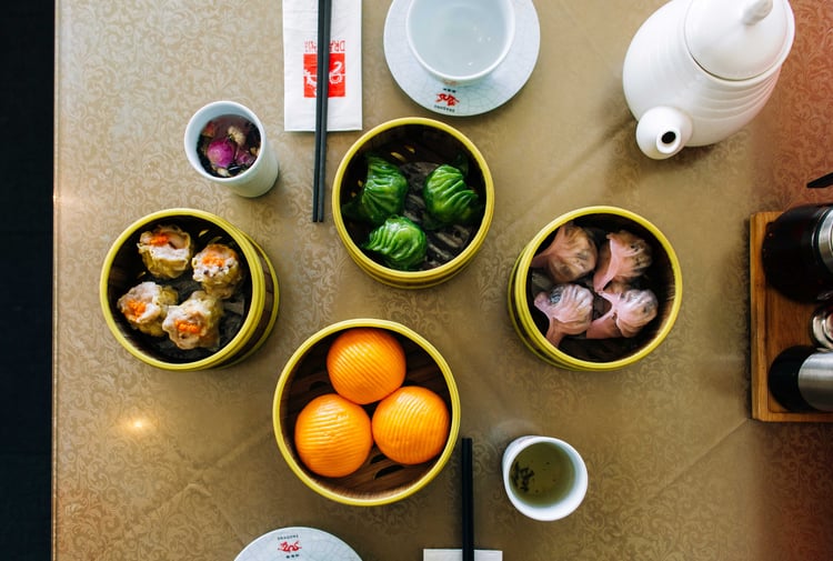 A flatlay of bowls of Chinese food at Dragons Wellington.