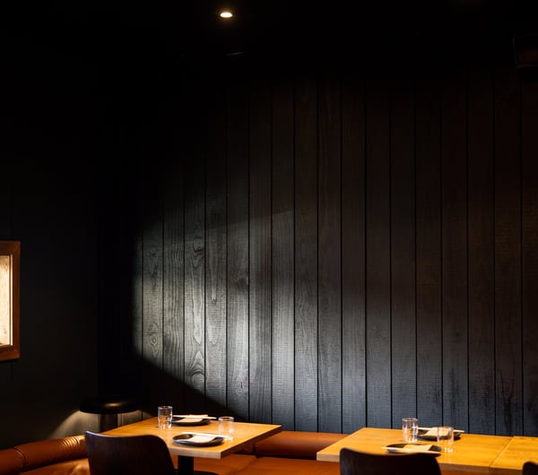 The black and wooden interior of Azabu restaurant in Auckland.
