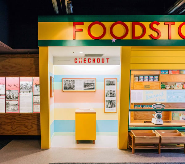 A yellow and green exterior of the retro food store.