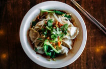 Bowl of dumplings in broth from Chinese restaurant in Hamilton.
