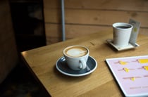 A coffee on a table.