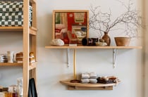 Kitchen and bathroom wares on a shelf.