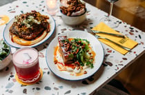 Plates of food on a terrazzo table inside Mary's in Havelock North.