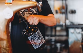 A bottle being filled up with craft beer at The Brewery Christchurch.