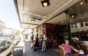 People milling about on Moray Place in Dunedin.
