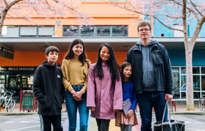 Mahalee and Benoit with their family on the streets of Palmerston North.