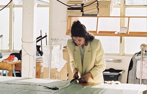Rachel Mills at work cutting a pattern.