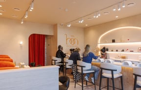 Clients sitting up at the nail bar getting their manicures done at 1999 House of Nails Ferrymead.