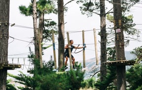 Person walking on rope.