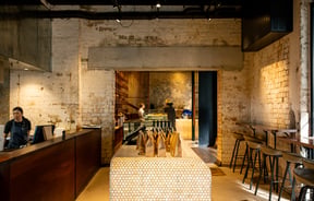 The cream interior of a large restaurant space.