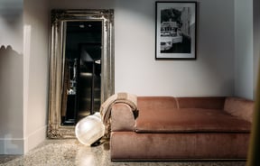 A soft couch in the dressing room of Angel Divine in Queenstown.
