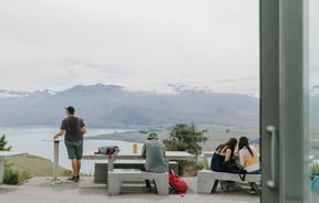 People looking out to the mountain views at Astro Cafe, Tekapo.