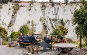 People sitting outside at Awastone in Rangitikei.