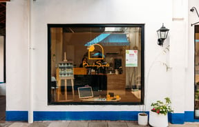 The blue and white exterior of Bamboo Sweets Hamilton.
