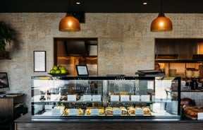 A glass counter inside a cafe.
