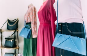 Mannequins wearing colourful clothing from Belle Bird Boutique.