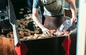 Bagels in bulk in the oven.