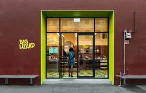 Customer walking through the front door at Big Lizard.