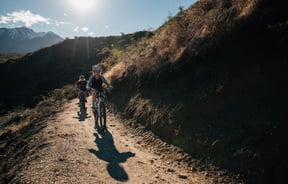 Kids cycling on track.