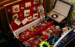 Vintage jewellery in a red box.