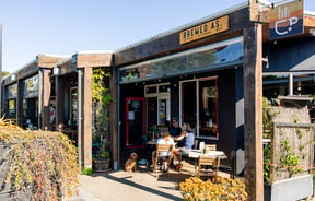 Table of diners outside Brewed As.