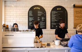 Staff members working behind the counter at Browns Eatery.