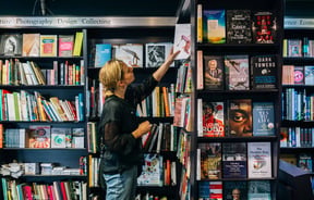 A woman looking at a book.