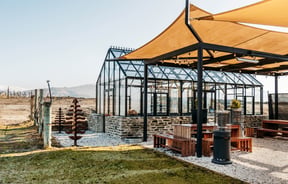 A large glasshouse outside Carrick Winery Bannockburn Central Otago.