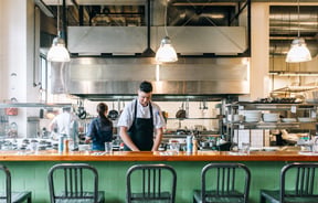 Chef at work in the kitchen at Charley Noble, Wellington.