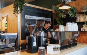 A barista making coffee.