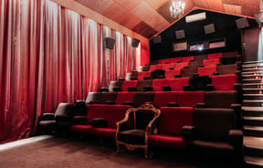 Red seating inside a cinema.