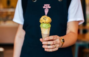 Someone holding an ice cream.