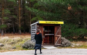 Customer walking up to the shed at Forage & Gold.