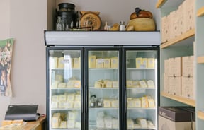 Lots of cheeses in big fridges at Geraldine Cheese Company.