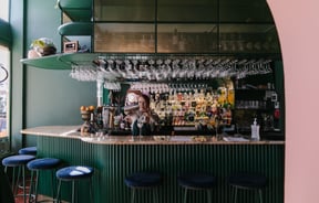 Woman pouring a cocktail at gin gin in Christchurch.