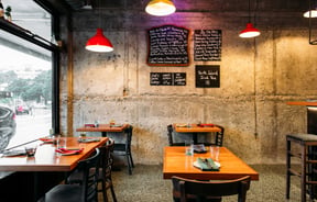 The small seating area inside the brightly lit Graze Wine Bar in Wellington.