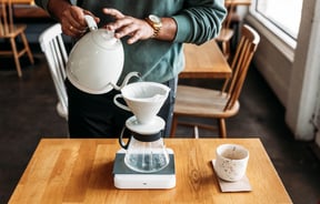 Barista is making a pourover coffee at Grey St Kitchen.