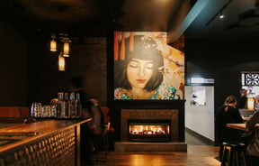 Artwork of a woman's face on the wall at Harry's Hawker House.