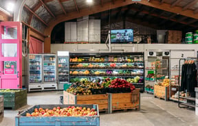 Fruit and vegetable stands inside the shopping area of Jackson Orchards.