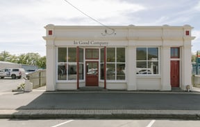 The cream brick building of In Good Company Kurow.