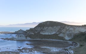 Sandy bay with cliffs on Kaikōura Peninsula Walkway, Kaikōura.