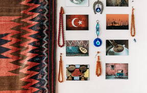 Turkish postcards and colourful beads on wall