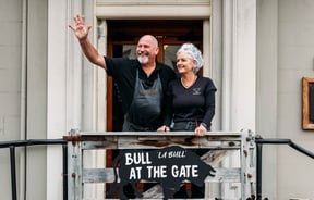 A man and woman standing outside La Bull in Rangitikei.