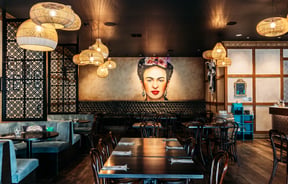 Frida Kahlo poster on the wall in the dining room of Libre.