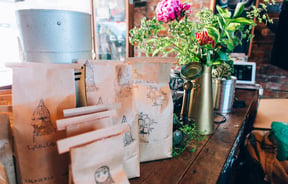 Close up of bags of coffee beans at Lyttelton Coffee Company cafe.