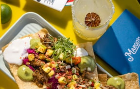A taco and a margarita on the table at Margo's.