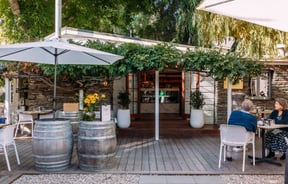 The vine covered entrance to Mora Wines Queenstown.